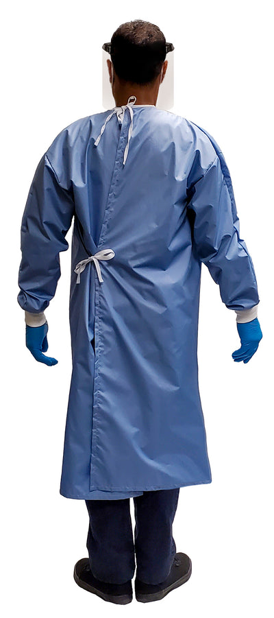 Man wearing a Fast Reusable Isolation Gown4000 Level 2 made with anti-static blue polyester material. Canadian Made. Back view.