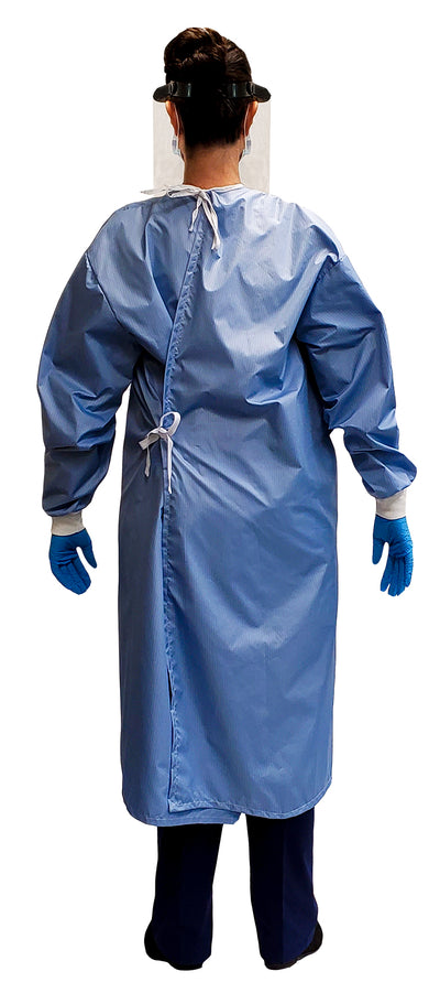 Woman wearing a Fast Reusable Isolation Gown4000 Level 2 made with anti-static blue polyester material. Canadian Made. Back view.